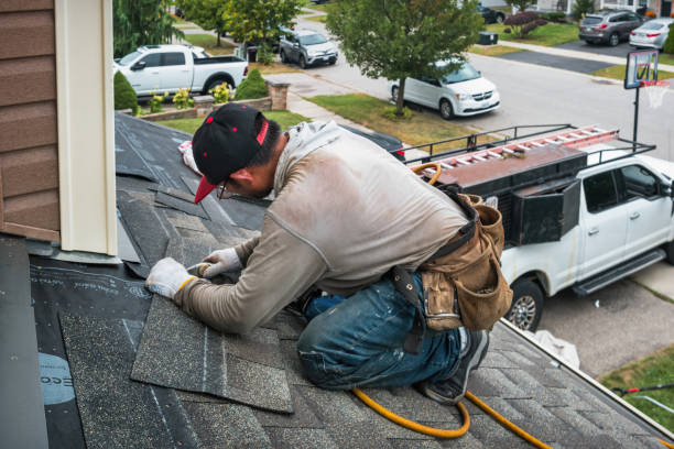 Professional Roofing technician working in Stratham, NH